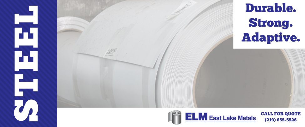 Large industrial metal coils in various colors and finishes at an East Lake Metals facility, representing the choice between aluminum vs steel for construction projects.