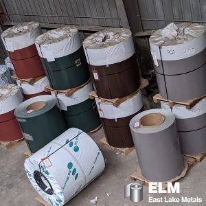 Vertical stacks of multi-colored painted architectural slit coils, demonstrating design versatility and the advantages of building with aluminum supplied by East Lake Metals.