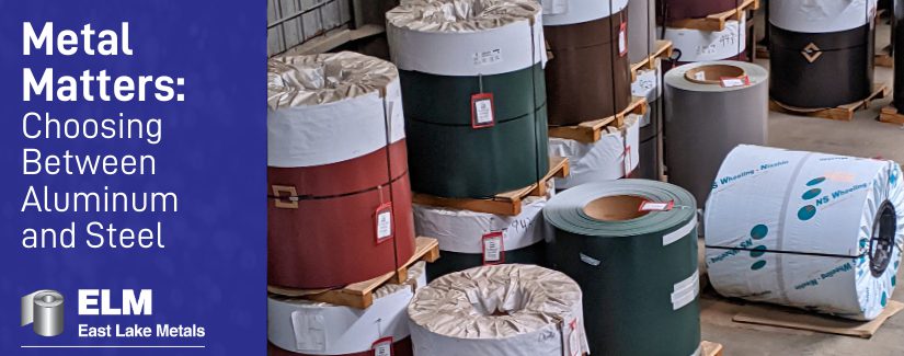 Large industrial metal coils in various colors and finishes at an East Lake Metals facility, representing the choice between aluminum vs steel for construction projects.