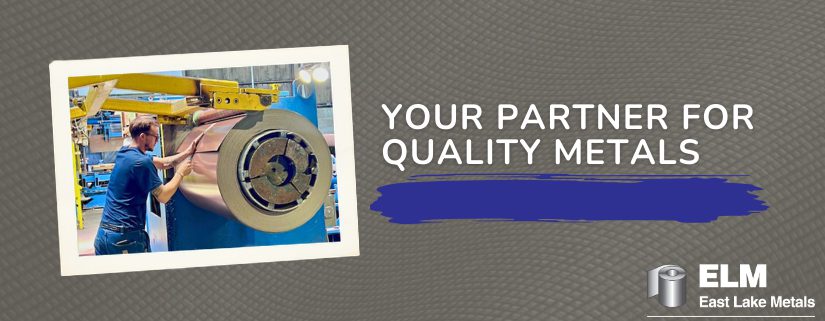 A technician in a manufacturing facility carefully inspecting a large copper-colored metal coil during the slitting process, highlighting the precision of an expert metal roofing supplier in Northwest Indiana.