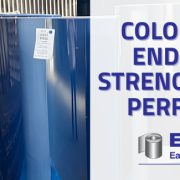 Large coils of vibrant blue and silver architectural metal, illustrating the high-performance prepainted metal color retention standards of East Lake Metals.
