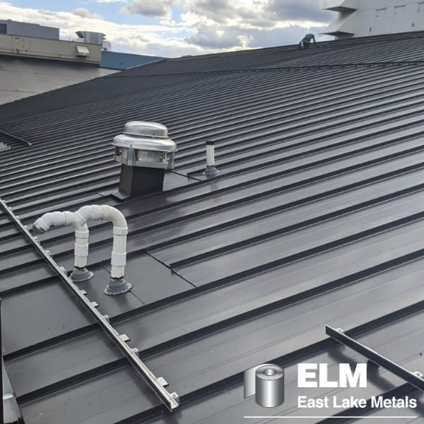 dark colored metal roof with penetrations